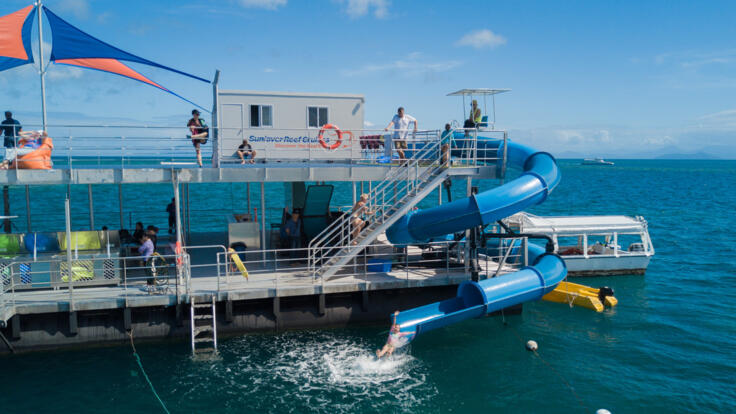 Waterslide with snorkellers at pontoon